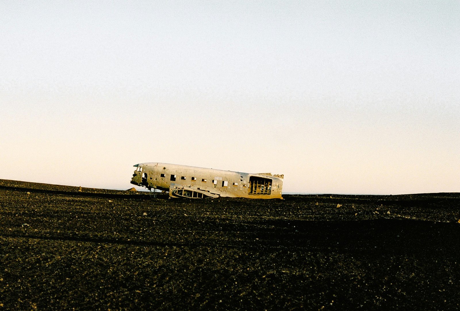 israelagent.com white airplane on gray sand during daytime