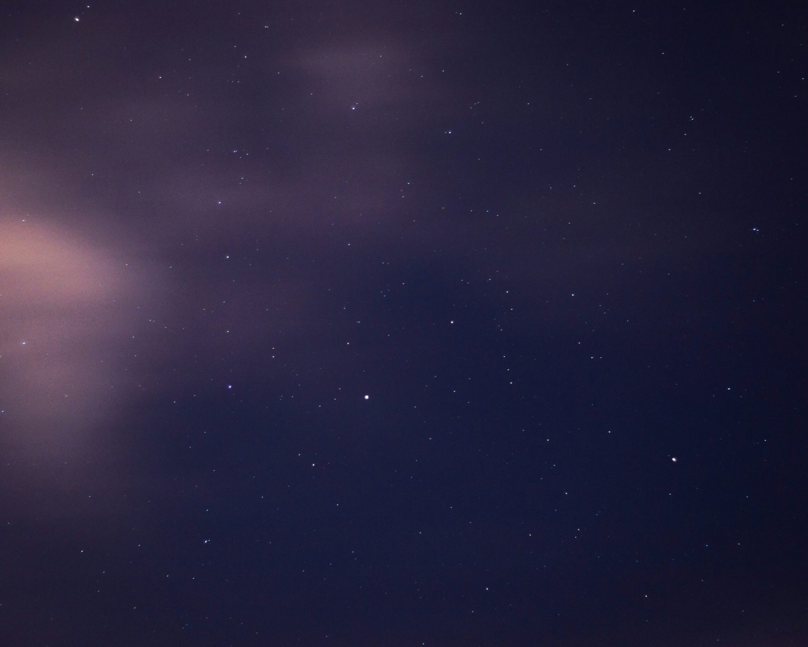 a night sky with stars and clouds